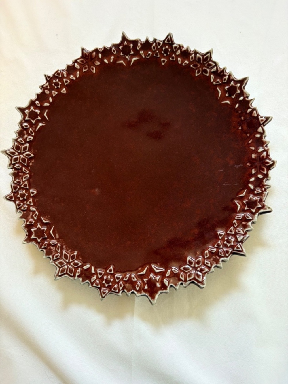 Burgundy Red Ceramic Signed Art Pottery Plate CutOut Border Stars/Snowflakes 10"